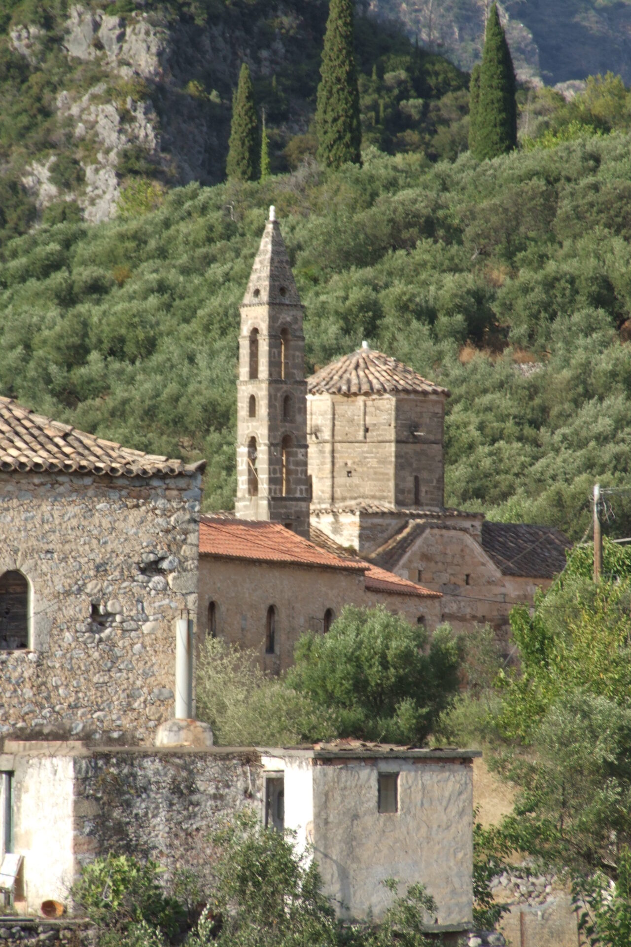 The church of Agios Spyridon among the stone houses of Old Kardamyli